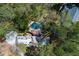 Overhead view highlighting the pool, landscaping, and architectural details of the residence at 9995 Huntcliff Trce, Atlanta, GA 30350
