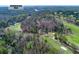 An aerial view shows the property near the Chattahoochee River and a golf course at 9995 Huntcliff Trce, Atlanta, GA 30350