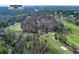 Scenic aerial view showcasing the Chattahoochee River, golf course, and surrounding landscape at 9995 Huntcliff Trce, Atlanta, GA 30350