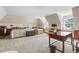 Spacious bedroom featuring two beds, built-in window seats, and sloped ceilings at 9995 Huntcliff Trce, Atlanta, GA 30350