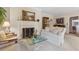 Living room with fireplace, decorative mantle, and cozy seating at 9995 Huntcliff Trce, Atlanta, GA 30350