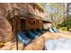 Brick patio with an awning, featuring covered lounge chairs for a comfortable outdoor living space at 9995 Huntcliff Trce, Atlanta, GA 30350
