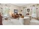 Bright sitting room with three large windows and neutral decor at 9995 Huntcliff Trce, Atlanta, GA 30350