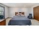 Spacious bedroom featuring a large bed, neutral walls, and comfortable seating area at 1888 Kelvin Dr, Lawrenceville, GA 30043