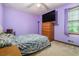 Bedroom featuring a bed with a large TV on the dresser at 1888 Kelvin Dr, Lawrenceville, GA 30043