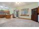 Open kitchen area with ample space for dining and meal preparation, featuring an exterior door and large window at 1888 Kelvin Dr, Lawrenceville, GA 30043