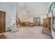 Bright living room showcasing a fireplace, comfortable seating, and a staircase leading to upper level at 1888 Kelvin Dr, Lawrenceville, GA 30043