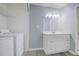 Bright bathroom featuring a vanity with drawers and modern lighting at 24317 Plantation Ne Dr, Atlanta, GA 30324