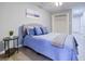 Inviting bedroom with a comfortable bed, side table and view of a closet at 24317 Plantation Ne Dr, Atlanta, GA 30324
