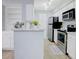 Modern kitchen featuring stainless steel appliances, white cabinets, and ample counter space at 24317 Plantation Ne Dr, Atlanta, GA 30324