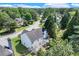 Aerial view of the backyard, showing a pergola, sunroom, and lush green lawn at 3517 Ridgemill Cir, Dacula, GA 30019