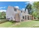 Spacious backyard with a pergola, outdoor seating, and a well-maintained lawn at 3517 Ridgemill Cir, Dacula, GA 30019