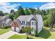 Well-maintained home featuring a brick and siding exterior, a two-car garage, and a beautifully landscaped front yard at 3517 Ridgemill Cir, Dacula, GA 30019