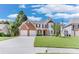Charming two-story home with a well-manicured lawn, brick accents, and a two-car garage at 3517 Ridgemill Cir, Dacula, GA 30019