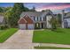 Charming two-story home with a well-manicured lawn and a two-car garage in a lovely suburban neighborhood at 3517 Ridgemill Cir, Dacula, GA 30019