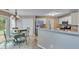 Open concept kitchen with granite counters, stainless appliances, and a nearby dining area for entertaining at 3517 Ridgemill Cir, Dacula, GA 30019