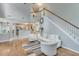 Open living room with staircase, hardwood floors, and neutral decor at 3517 Ridgemill Cir, Dacula, GA 30019