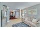 Comfortable living area with neutral paint, a dining area view, and natural lighting at 3517 Ridgemill Cir, Dacula, GA 30019