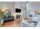 Bright living room with hardwood floors, fireplace, and elegant decor at 3517 Ridgemill Cir, Dacula, GA 30019