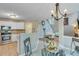 Kitchen and Living Space: Open layout featuring modern appliances, dining table, and staircase at 3517 Ridgemill Cir, Dacula, GA 30019