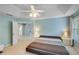 Spacious main bedroom featuring a tray ceiling and ample natural light at 3517 Ridgemill Cir, Dacula, GA 30019