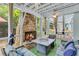 Cozy sunroom featuring a stone fireplace, comfortable seating, and natural light at 3517 Ridgemill Cir, Dacula, GA 30019
