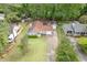 Aerial view showcases the charming home with a well-manicured lawn and long driveway at 376 Paula Ct, Lawrenceville, GA 30046