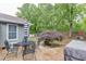Private backyard with mature trees, patio area, and lush landscaping at 376 Paula Ct, Lawrenceville, GA 30046