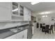 Eat-in kitchen with stainless steel appliances, dark countertops and white cabinetry at 376 Paula Ct, Lawrenceville, GA 30046