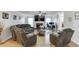 Comfortable living room with hardwood floors, a fireplace, and an open layout at 376 Paula Ct, Lawrenceville, GA 30046
