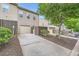 Townhome backyard with private driveway, detached garage, and mature trees at 3807 Cyrus Ridge Nw Way, Kennesaw, GA 30152