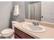 Neutral bathroom featuring a large vanity, toilet and shower with white chevron shower curtain at 3807 Cyrus Ridge Nw Way, Kennesaw, GA 30152