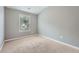 Neutral bedroom featuring plush carpeting, light gray paint, and a window to bring in natural light at 3807 Cyrus Ridge Nw Way, Kennesaw, GA 30152