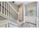 Entryway with staircase, white wainscoting, and a glass-paneled front door at 3807 Cyrus Ridge Nw Way, Kennesaw, GA 30152
