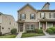 Charming two-story townhome with brick accents, green shutters, and well-manicured landscaping at 3807 Cyrus Ridge Nw Way, Kennesaw, GA 30152