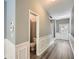 Entryway with half bath and wood floors with painted trim and baseboards and stairway in background at 3807 Cyrus Ridge Nw Way, Kennesaw, GA 30152