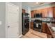 Modern kitchen with stainless steel appliances, wood cabinets, and stylish backsplash at 3807 Cyrus Ridge Nw Way, Kennesaw, GA 30152