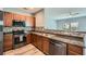 Close-up of the kitchen featuring stainless steel appliances and mosaic backsplash at 3807 Cyrus Ridge Nw Way, Kennesaw, GA 30152