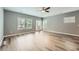 Bright living area featuring stylish floors, multiple windows, and a back door for outdoor access at 3807 Cyrus Ridge Nw Way, Kennesaw, GA 30152