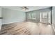 Spacious open floor plan with modern gray paint, updated floors, and a ceiling fan at 3807 Cyrus Ridge Nw Way, Kennesaw, GA 30152