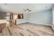 Open-concept living room with new flooring, modern ceiling fan, and ample natural light at 3807 Cyrus Ridge Nw Way, Kennesaw, GA 30152