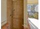 Exterior shower with tile surround, safety bar and hand-held shower-head is convenient for rinsing off after a swim at 3807 Cyrus Ridge Nw Way, Kennesaw, GA 30152