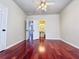 Bedroom showcasing hardwood floors, neutral walls and ensuite bathroom access at 4056 Kingsley Park Ct, Peachtree Corners, GA 30096