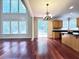 Dining area features beautiful hardwood floors and natural light from the large windows at 4056 Kingsley Park Ct, Peachtree Corners, GA 30096