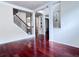 Open-concept foyer with staircase and hardwood floors, leading to other living areas of the home at 4056 Kingsley Park Ct, Peachtree Corners, GA 30096