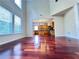 Bright, open living room with hardwood floors and large windows overlooking the front yard at 4056 Kingsley Park Ct, Peachtree Corners, GA 30096