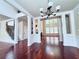 Spacious living room showcasing hardwood floors, white columns, fireplace, and an open layout perfect for entertaining at 4056 Kingsley Park Ct, Peachtree Corners, GA 30096