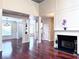 Open-concept living space with hardwood floors, fireplace, and elegant columns; ample natural light and versatile layout at 4056 Kingsley Park Ct, Peachtree Corners, GA 30096