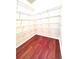 Pantry featuring hardwood floors and wire shelving at 4056 Kingsley Park Ct, Peachtree Corners, GA 30096