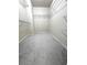 Spacious walk-in closet with ample shelving and gray carpeting, providing plenty of storage space at 4056 Kingsley Park Ct, Peachtree Corners, GA 30096
